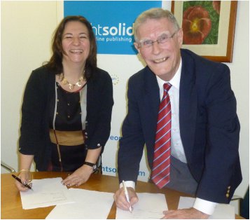 Elaine Collins and Peter Bailey Elaine Collins, Commercial Director, brightsolid Online Publishing & Peter Bailey, Chairman, FIBIS, sign the contract